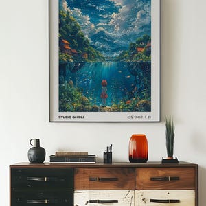 May include: A poster for the Studio Ghibli film "Ponyo" by Hayao Miyazaki. The poster features a young girl standing on a rock in the water, looking out at a beautiful landscape. The text on the poster reads "Ponyo", "Studio Ghibli", "Hayao Miyazaki", and "となりのトトロ".