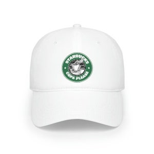 May include: White baseball cap with a green Starbucks logo that says "Starbucks Cups Please" in a circle.