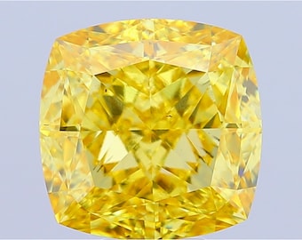 May include: A cushion-cut, fancy vivid yellow diamond. The gemstone has a square shape with rounded corners and numerous facets that reflect light. The diamond's color is a vibrant, intense yellow, and it appears to be set against a light background.