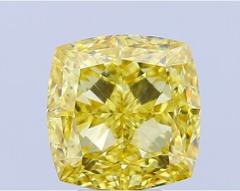 May include: A cushion-cut, fancy vivid yellow diamond. The gemstone has a square shape with rounded corners and numerous facets that reflect light. The diamond's color is a rich, intense yellow, and it appears to be set against a light background.