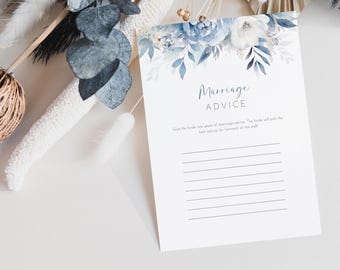 May include: A white card with blue watercolor floral designs at the top. The card says "Marriage Advice" and has lines for guests to write advice for the couple.