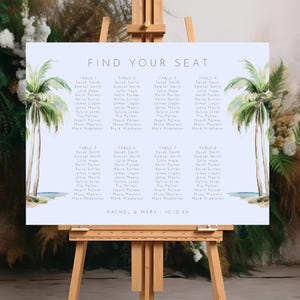 May include: A light blue wedding seating chart with a tropical theme. The chart features two palm trees on each side and the text "Find Your Seat". The chart lists the names of guests assigned to each table.