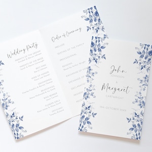 May include: A wedding ceremony program with a blue floral design. The program includes the order of ceremony and the wedding party. The front cover features the names "John Johnson & Margaret Cartwright" and the date "18th October 20XX".