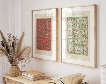 May include: Two framed prints with floral patterns and the text "Flower Market" above each design. The print on the left has a red floral pattern and the text "Barcelona" below the design. The print on the right has a green and pink floral pattern and the text "Madrid" below the design.
