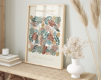 May include: A framed print with a nature-inspired design featuring a variety of leaves in shades of green, brown, and gold. The print is titled "Nature Spirit Leaf Collection".