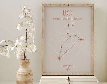 May include: A minimalist printable poster with a light brown background featuring the Leo zodiac sign constellation with gold stars. The text "LEO" is in brown at the top of the poster. Below the constellation, the text "DYNAMIC - ROMANTIC - BENEVOLENT" is in brown. Below that, the text "JUL 23 - AUG 22" is in brown. Below that, the text "SUN" is in brown. The poster is framed in a light brown wood frame.