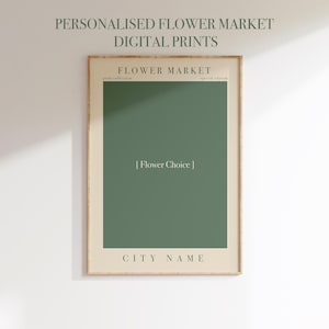 May include: A framed digital print with the text "PERSONALISED FLOWER MARKET DIGITAL PRINTS". The print features a green rectangle with the text "[Flower Choice]" and "CITY NAME" below. The words "FLOWER MARKET" are at the top.