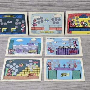 Lote de 7 tarjetas raspaditas Topps Super Mario Brothers de Nintendo de 1989, en perfecto estado