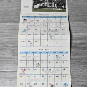 May include: A vintage 1963 calendar featuring Prospect Hall, Frederick, Maryland. The calendar shows April and May, with illustrations and text promoting electrical appliances. The calendar is printed on aged paper, with measurements in inches.