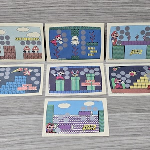 Lote de 7 tarjetas raspaditas Topps Super Mario Brothers de Nintendo de 1989, en perfecto estado