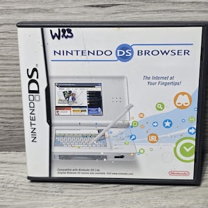 May include: A Nintendo DS Browser game case featuring a white handheld console on the cover. The text reads NINTENDO DS BROWSER, The Internet at Your Fingertips!, and Compatible with Nintendo DS Lite. The design includes colorful icons and a stylus.