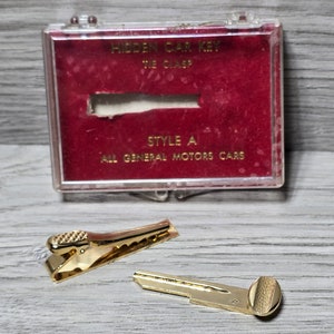 1960s GM Motor Co Tie Bar Clasp Car Advertising Dealer Hidden Car Key
