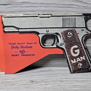 Pistola de papel y cartón con publicidad de Dolly Madison, G-Man Straight Shooters, de los años 50