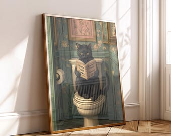 May include: Framed artwork featuring a black cat sitting on a toilet, engrossed in a book titled "How to Train Humans." The cat is in a vintage bathroom setting with floral wallpaper and a gold frame.