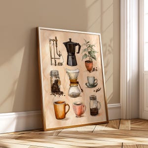 May include: Watercolor print featuring coffee-related items. Includes a moka pot, a pour-over coffee maker, coffee beans in a jar, a small potted plant, and various coffee cups. The artwork is framed in a gold-colored frame.