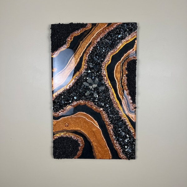 Copper and black resin artwork with real quartz crystals and pyrite pieces.