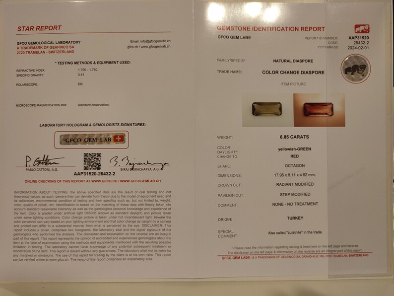 May include: A gemstone identification report for a 6.85 carat, yellowish-green to red color change diaspore. The report details the gemstone's weight, color, shape, dimensions, and origin. The report is from GFCO Gemological Laboratory, a trademark of Geafinco SA, Switzerland.