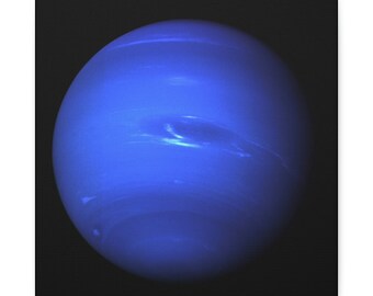 May include: A close-up image of the planet Neptune, a blue gas giant with visible cloud bands. The planet is set against a black background.