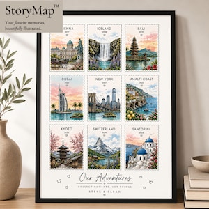 May include: A framed wall art print featuring nine illustrated postage stamps depicting travel destinations including Vienna, Iceland, Bali, Dubai, New York, Amalfi Coast, Kyoto, Switzerland, and Santorini, with the text Our Adventures, Steve & Sarah.