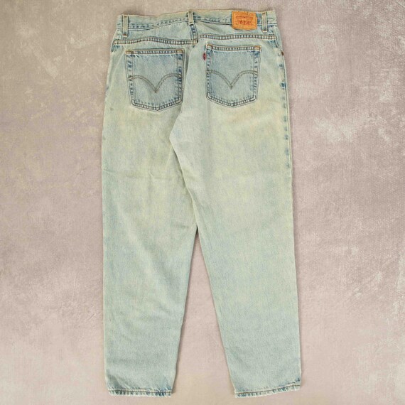 Vintage Levi's 560 Relaxed Tapered Fit Bleach Fade Jeans W34