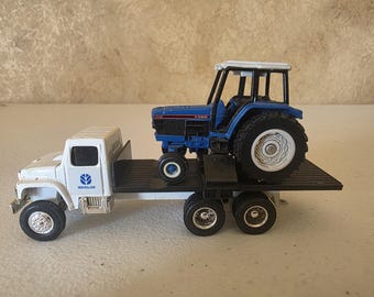 New Holland flatbed truck and tractor. 1/64 scale
