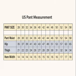 Peut inclure: Un tableau intitul&eacute; "US Pant Measurement" avec les mesures de taille de pantalon, de taille, de hanches, de cuisses et de largeur d'ourlet. Les tailles varient de 71 &agrave; 147 cm. Le tableau est sur fond beige clair.