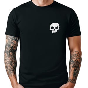 May include: Black t-shirt with a white skull and crossbones graphic on the left chest. The skull has a distressed look.