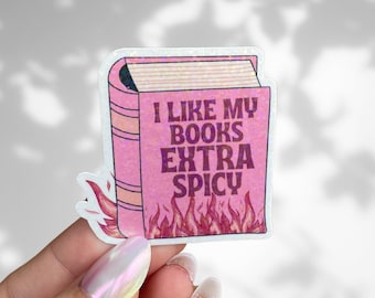 Puede incluir: Pegatina de libro rosa con purpurina y llamas. La pegatina dice "Me gustan mis libros extra picantes".