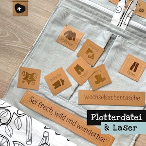 May include: A light grey corduroy organiser with multiple pockets and brown leather tags. The tags are labelled with clothing items like "Pullover", "Socks", and "Jogger". The text "Plotterdatei & Laser" is also visible.