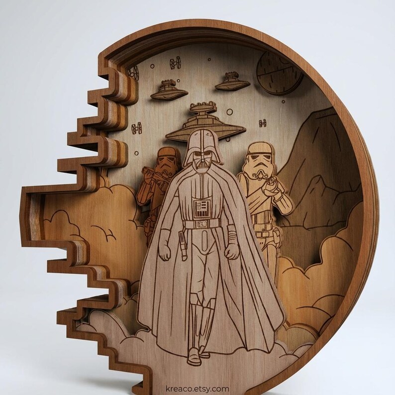 May include: A layered wooden artwork featuring Darth Vader and Stormtroopers from Star Wars. The artwork is circular with a detailed, laser-cut design. The piece includes spaceships, planets, and a mountain range, all in shades of brown.