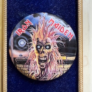 May include: A set of three ceramic mugs with a speckled, matte finish. The mugs are in shades of cream, light gray, and dark gray. Each mug has a simple, minimalist design, perfect for coffee or tea.