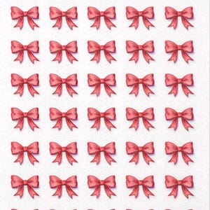 May include: A sheet of mini stickers featuring a repeating pattern of red bows. The bows are evenly spaced and arranged in rows and columns. The words "Mini Sticker Sheet" are written in cursive at the top.