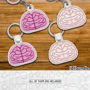 May include: Four pink and white brain-shaped keyrings with key rings. The keyrings are on a wooden surface. The text "IZIbUNDLE" is at the bottom of the image. Below the keyrings are 12 different shapes, including a star, heart, circle, and square. The text "ALL OF THEM ARE INCLUDED" is below the shapes.
