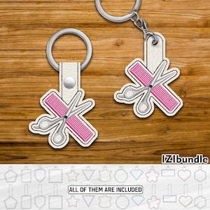 May include: Two white textured keychains featuring a graphic of silver scissors crossed over a pink comb. Each keychain has a silver metal split ring attached to a white strap with a silver snap button. The text IZIbundle is in the bottom right.
