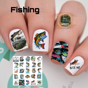 May include: A sheet of 24 nail decals featuring various fishing-themed designs. The designs include fish, fishing lures, fishing rods, and the text "Bite Me".