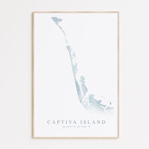 May include: A minimalist print of Captiva Island, Florida, with a light blue outline of the island on a white background. The print includes the text "CAPTIVA ISLAND" and the coordinates "26.5276° N, 82.1848° W".