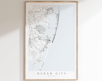 May include: A black and white line art map of Ocean City, Maryland. The map shows the streets and coastline of the city. The city name is printed in black text at the bottom of the map.