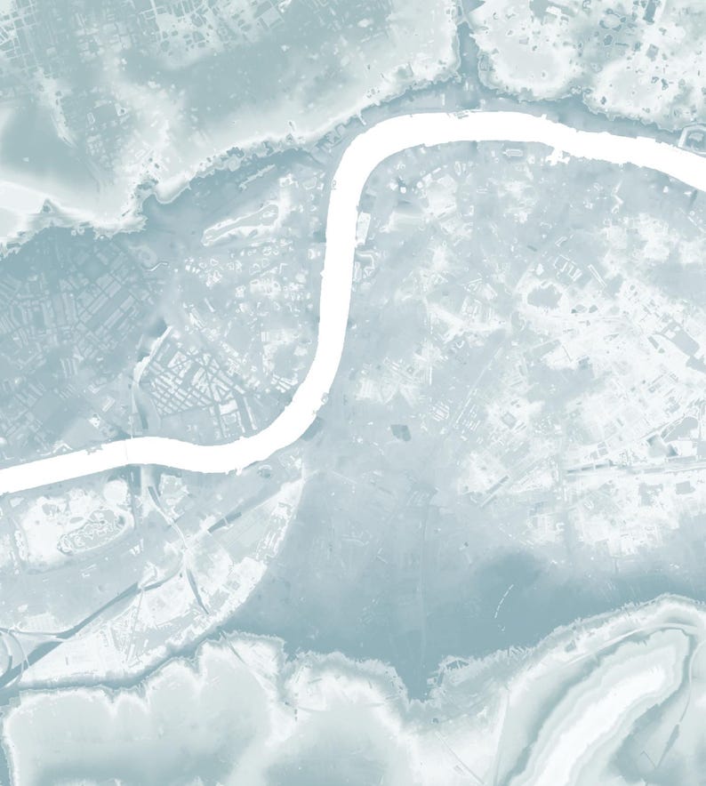 May include: An aerial view of a city with a winding river running through it. The river is white and the city is a light blue color.