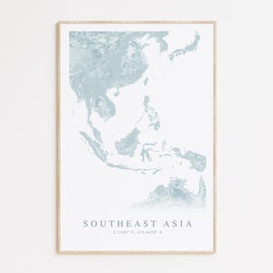 May include: A light blue print of a map of Southeast Asia with the text "Southeast Asia" and coordinates "2.2180° N, 113.8428° E".