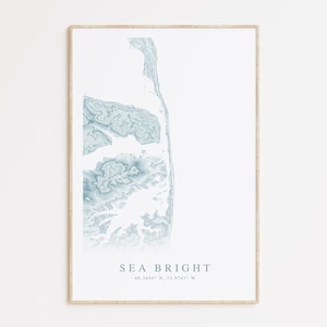 May include: A minimalist print of a blue and white topographic map of Sea Bright, New Jersey. The print includes the coordinates 40.3634° N, 73.8741° W.