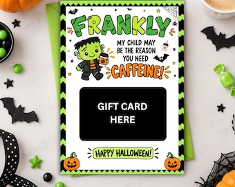 May include: A rectangular Halloween gift card holder featuring a cartoon Frankenstein monster holding a coffee cup. The text reads FRANKLY MY CHILD MAY BE THE REASON YOU NEED CAFFEINE! and HAPPY HALLOWEEN! with a black box labeled GIFT CARD HERE.