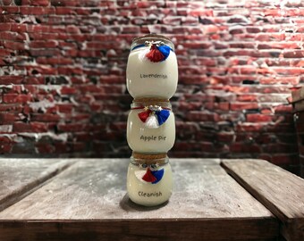 Soy Wax Scented Candle in a Small Corked Vessel. Hand poured and Made in small batches. Choose a scent. Each scent comes with designed jar.