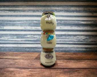 Soy Wax Scented Candle in a Small Corked Vessel. Hand poured and Made in small batches. Choose a scent. Each scent comes with designed jar.