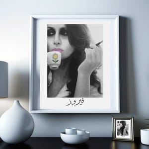 May include: Black and white portrait of a woman holding a teacup with a pink flower design. The text "قريباً" is written in Arabic below the woman.