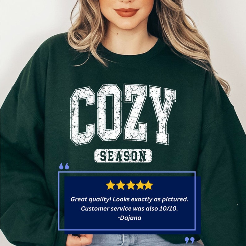 May include: A dark green sweatshirt with a white distressed graphic that says "COZY SEASON".