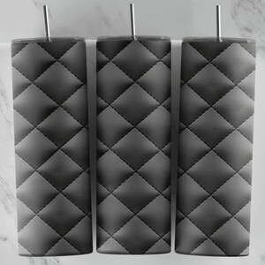 May include: Three black quilted tumblers with a diamond pattern. The tumblers are made of stainless steel and have a straw hole.