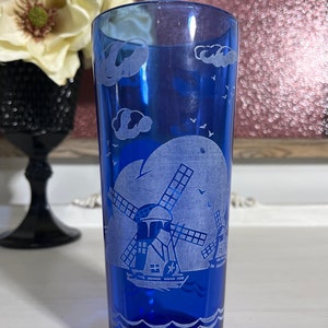 Premium Photo | Blue water in a glass on a white background 3d rendering