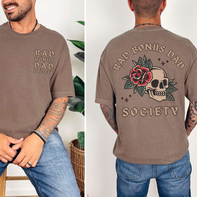 May include: A brown t-shirt with the text "Rad Bonus Dad Society" and a skull and rose graphic.