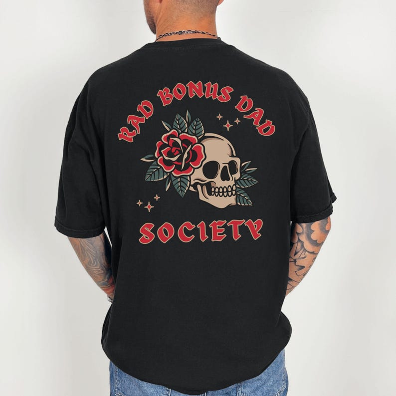 May include: Black t-shirt with a red skull and rose graphic and the text "Rad Bonus Dad Society" printed on the back.