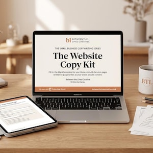 May include: A laptop displaying The Website Copy Kit by Between the Lines Creative, featuring fill-in-the-blank templates for Home, About, and Services pages. A tablet shows a template page, and a white mug with BTL branding sits nearby.